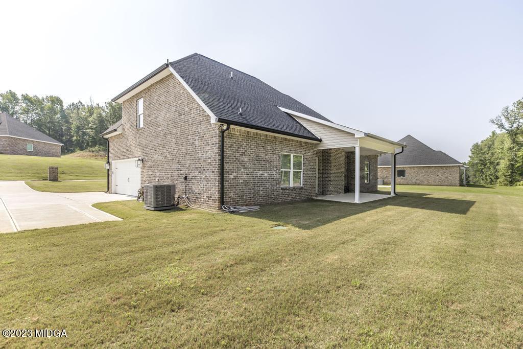 129 Timber Ridge Circle Byron, GA 31008 - Photo 39 of 42 a view of an house with backyard and road