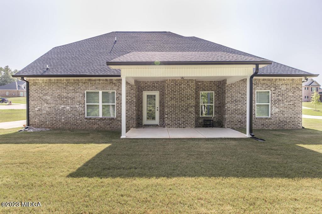 129 Timber Ridge Circle Byron, GA 31008 - Photo 40 of 42 a front view of a house with a yard and garage