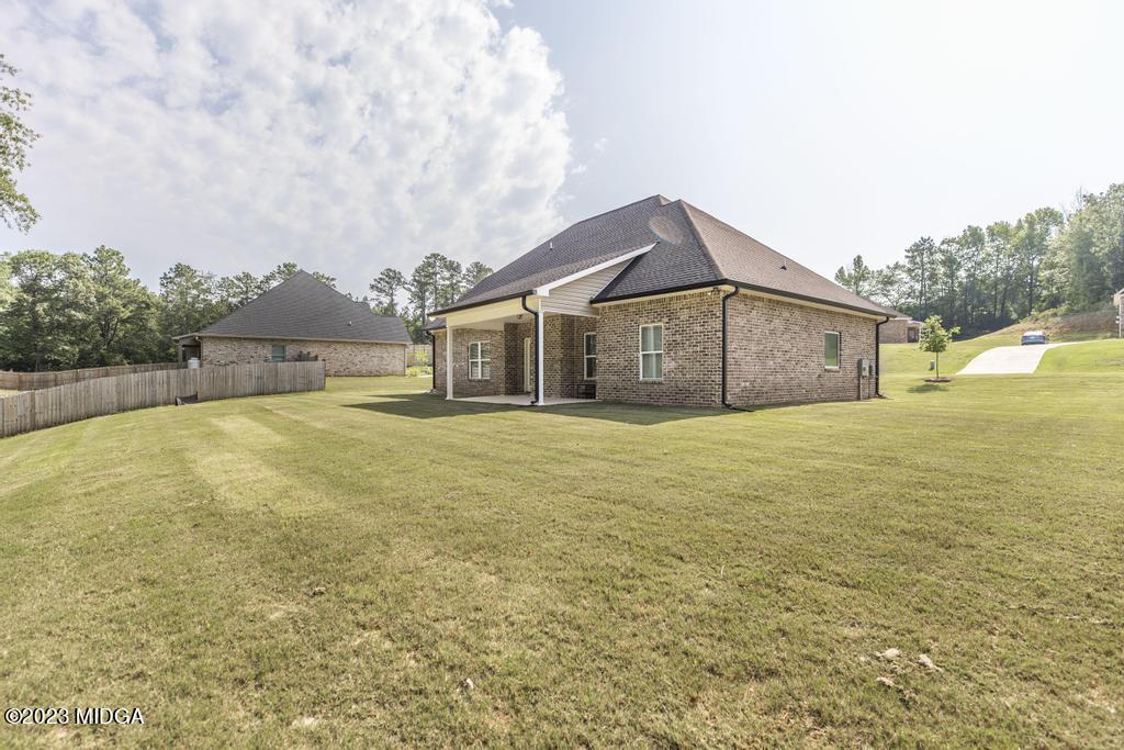 129 Timber Ridge Circle Byron, GA 31008 - Photo 41 of 42 a front view of a house with a garden
