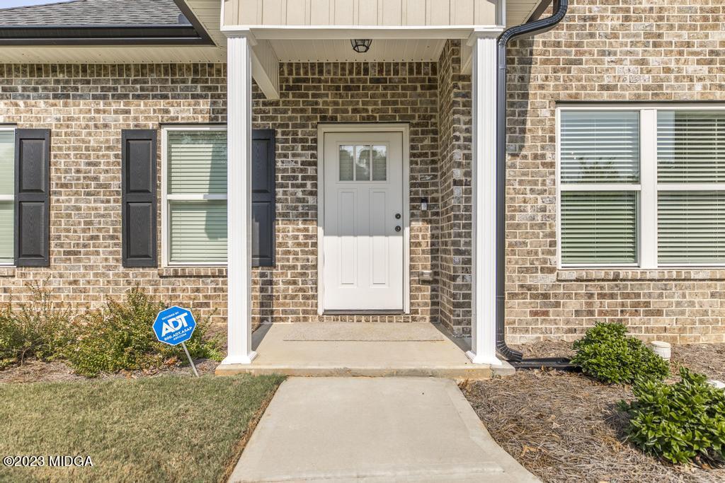129 Timber Ridge Circle Byron, GA 31008 - Photo 6 of 42 a front view of a house with a street