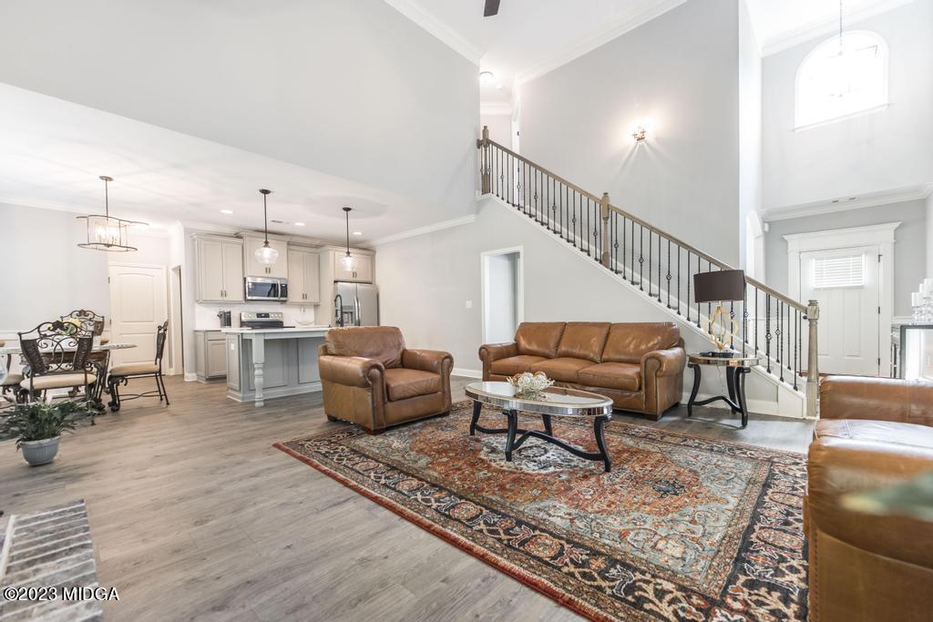 129 Timber Ridge Circle Byron, GA 31008 - Photo 10 of 42 a living room with furniture kitchen view and a table