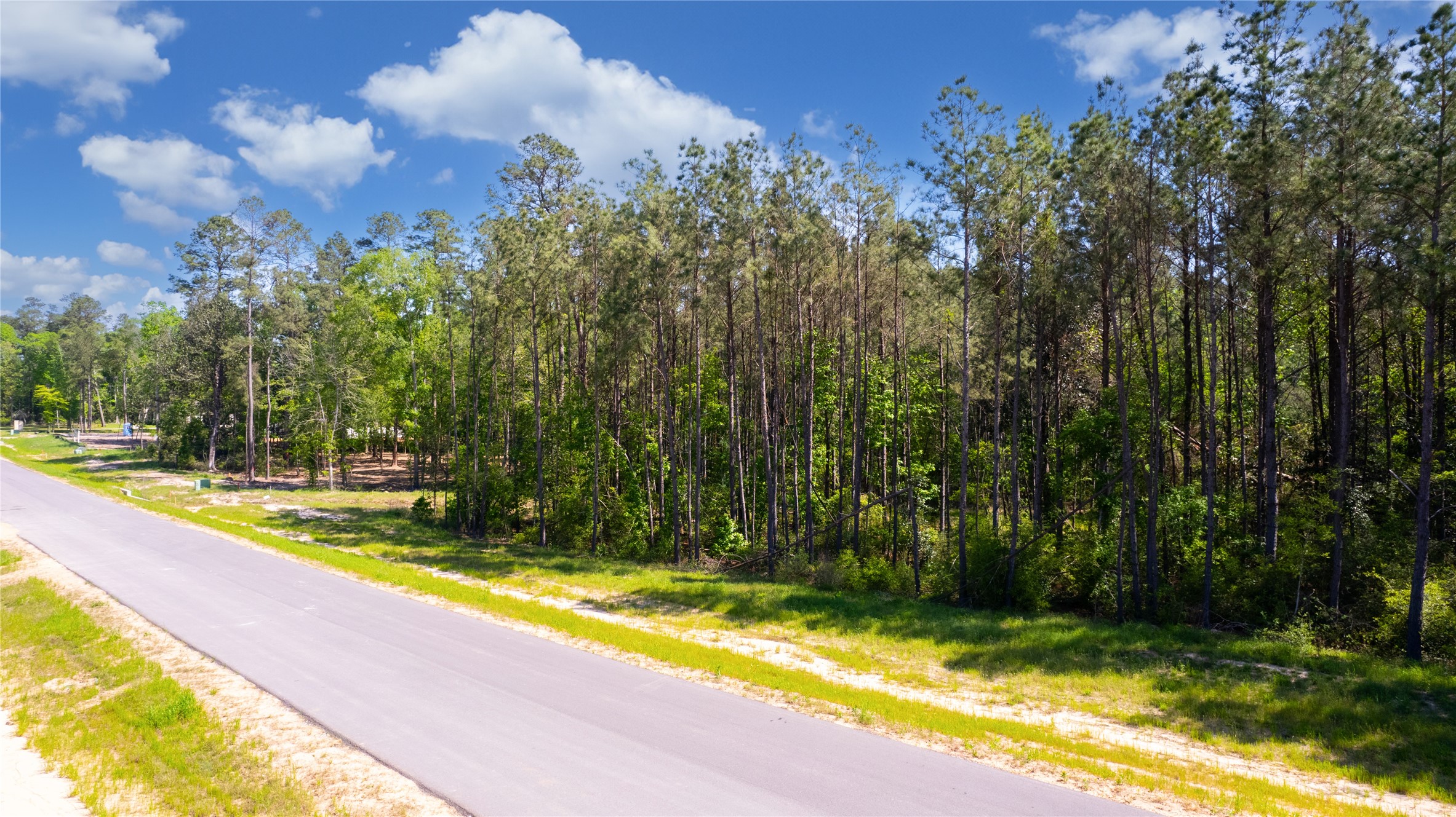 12868 Oak Barrel Road Willis, TX 77378 - Photo 29 of 32 a view of a swimming pool with an outdoor space and seating area