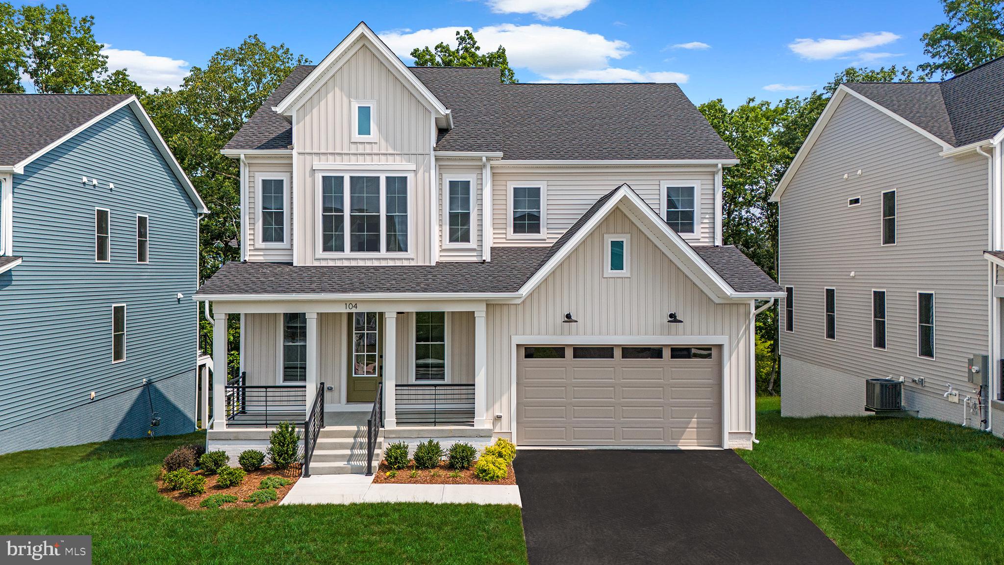 104 Alabaster Lane Stephenson, VA 22656 - Photo 1 of 48 a front view of a house with a yard and garage