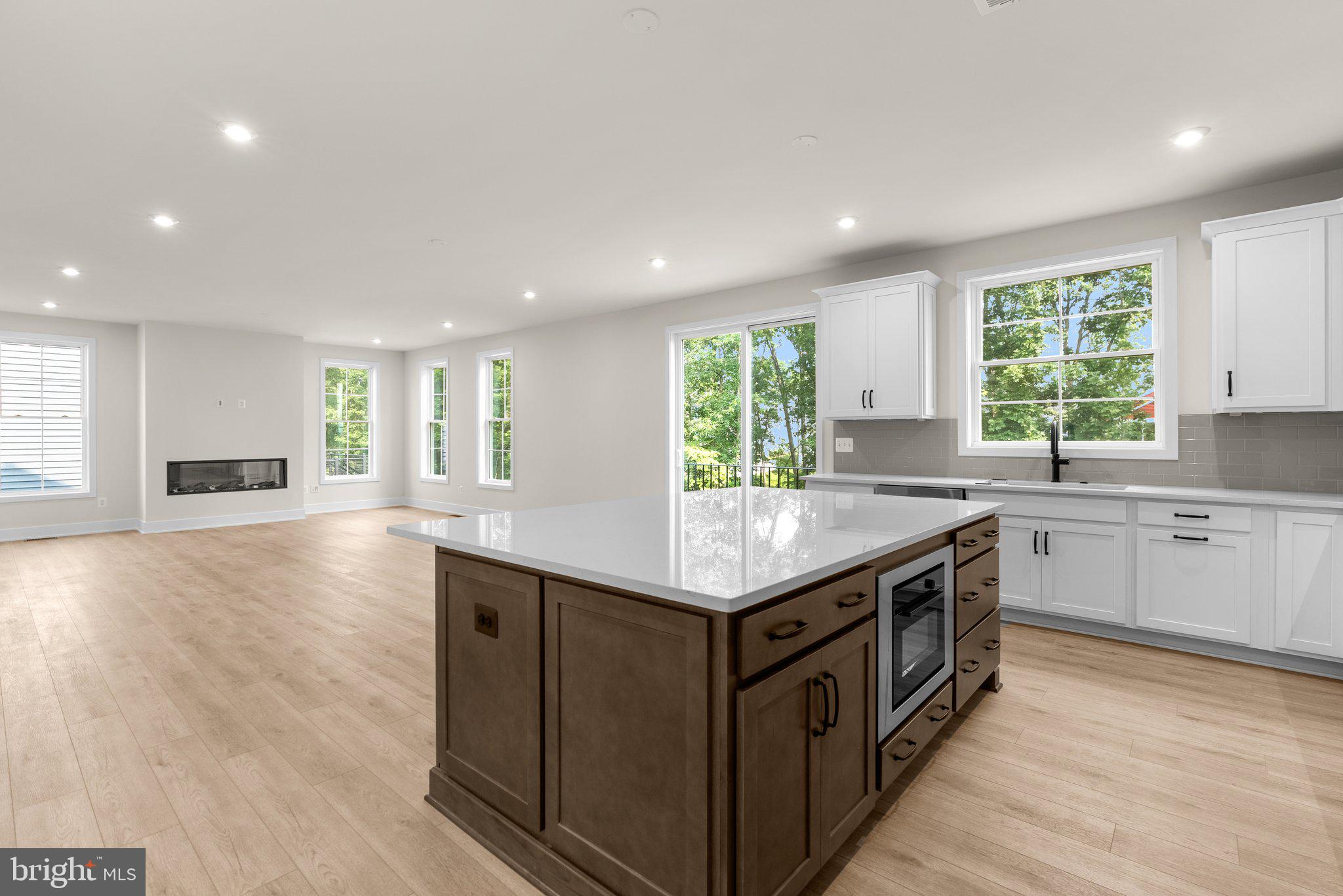 104 Alabaster Lane Stephenson, VA 22656 - Photo 14 of 48 a kitchen with stainless steel appliances granite countertop a sink a stove and a wooden floors
