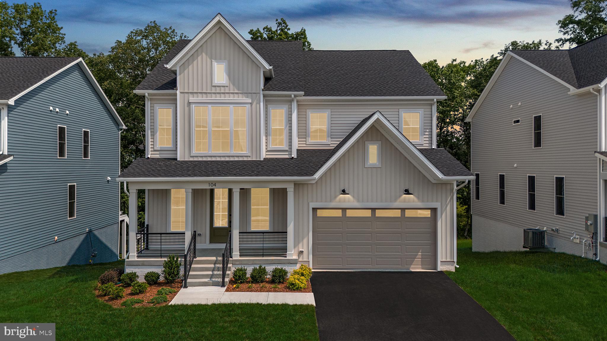 104 Alabaster Lane Stephenson, VA 22656 - Photo 2 of 48 a front view of a house with a yard and garage