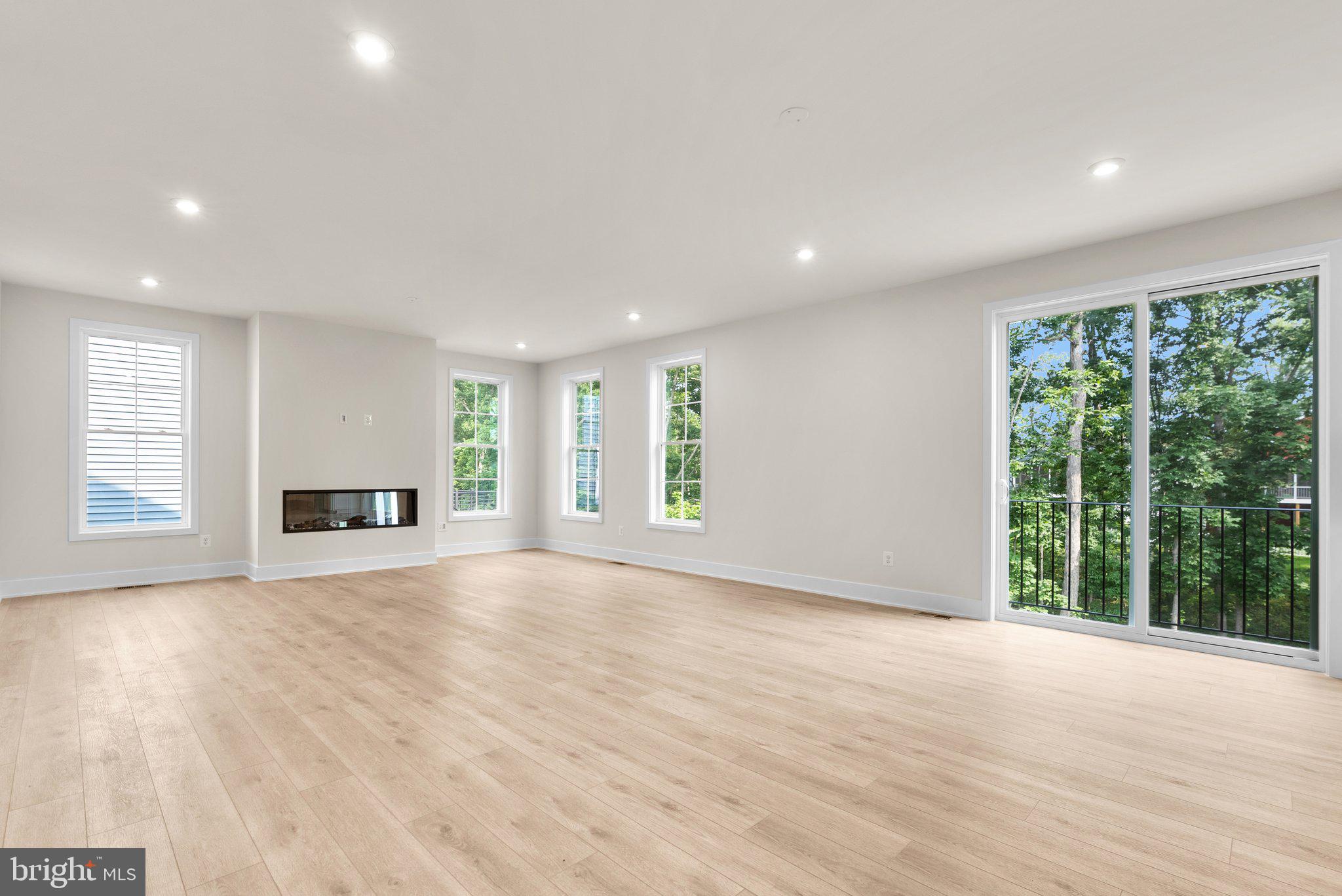 104 Alabaster Lane Stephenson, VA 22656 - Photo 21 of 48 a view of an empty room with wooden floor and a window