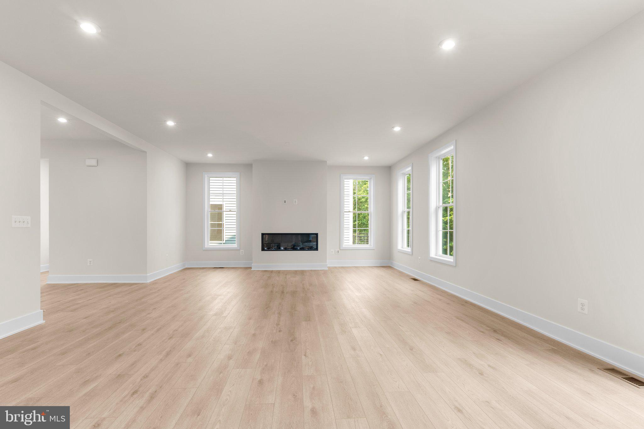 104 Alabaster Lane Stephenson, VA 22656 - Photo 22 of 48 a view of an empty room with wooden floor and a window