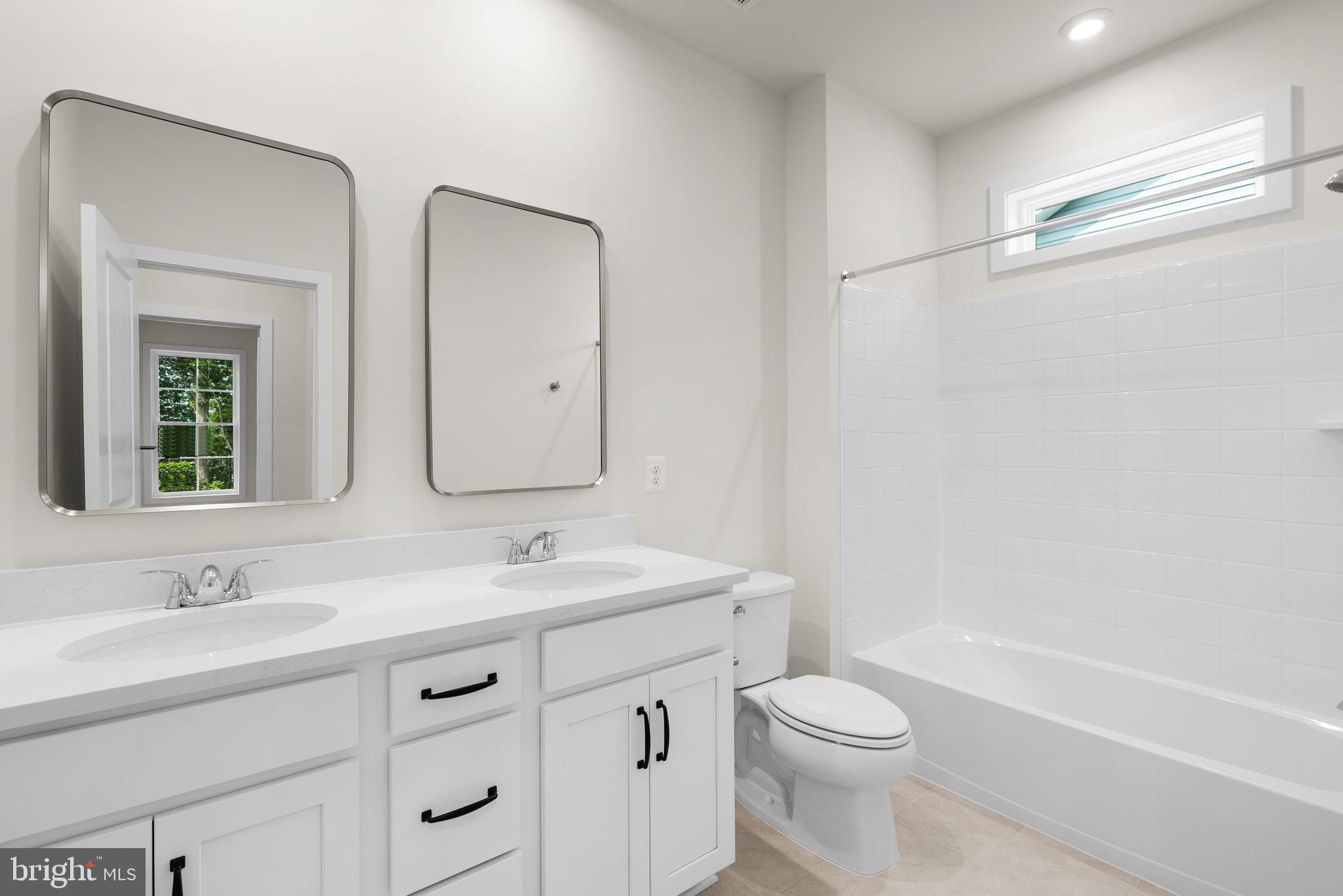 104 Alabaster Lane Stephenson, VA 22656 - Photo 33 of 48 a bathroom with a sink a toilet and a mirror