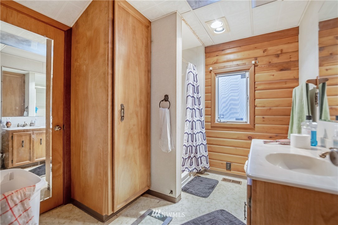 16407 Spanaway Loop Road South Spanaway, WA 98387 - Photo 11 of 20 a bathroom with a sink and a mirror