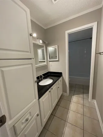 a kitchen with a sink and a stove