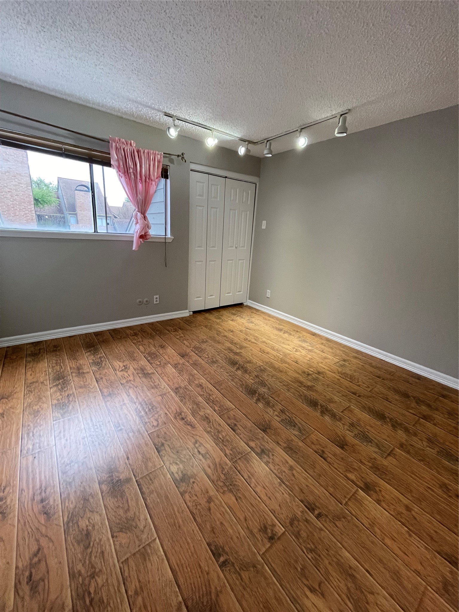 6601 Sands Point Drive, Unit 63 Houston, TX 77074 - Photo 8 of 18 wooden floor in an empty room