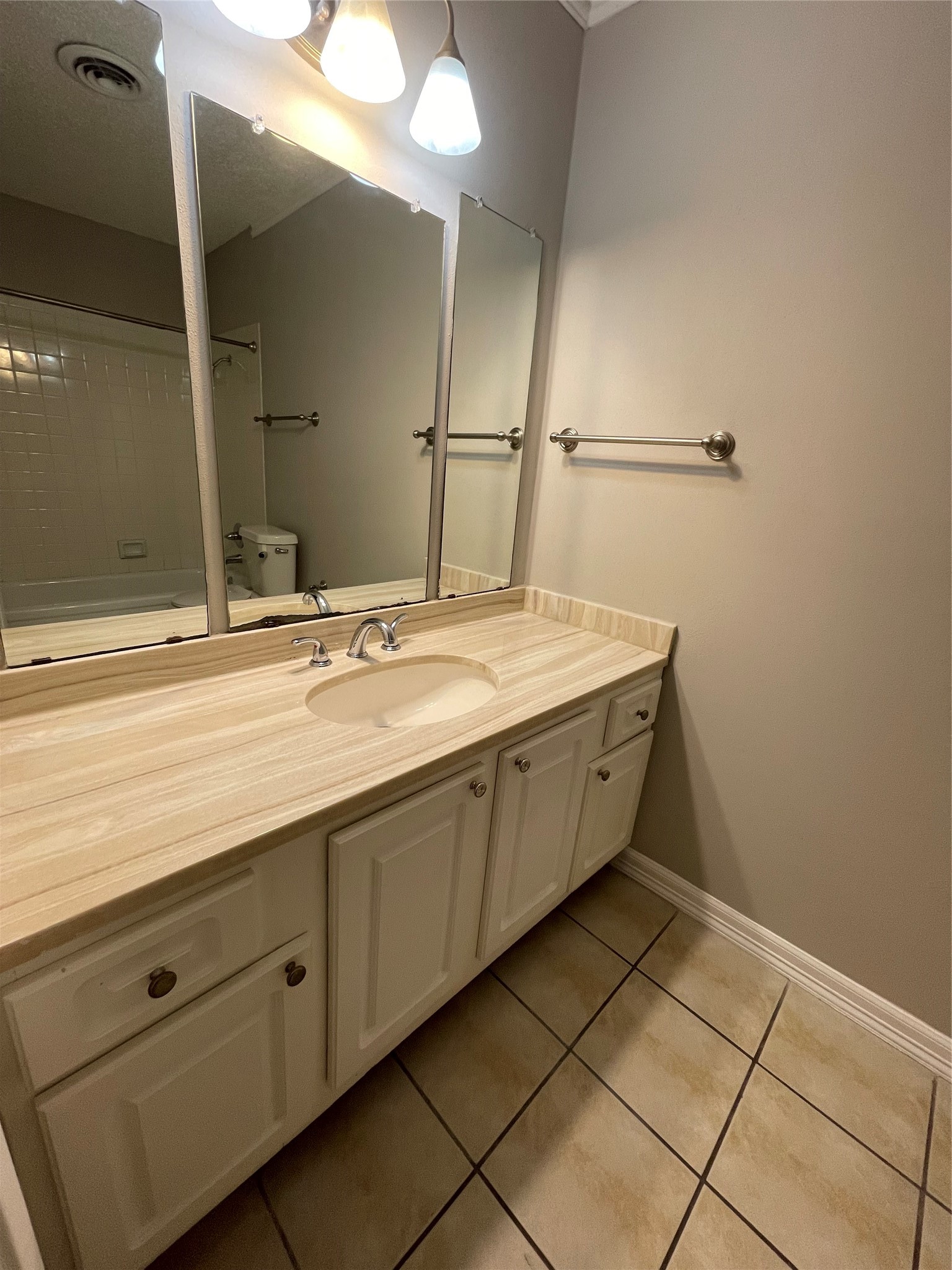 6601 Sands Point Drive, Unit 63 Houston, TX 77074 - Photo 9 of 18 a bathroom with a sink and a mirror