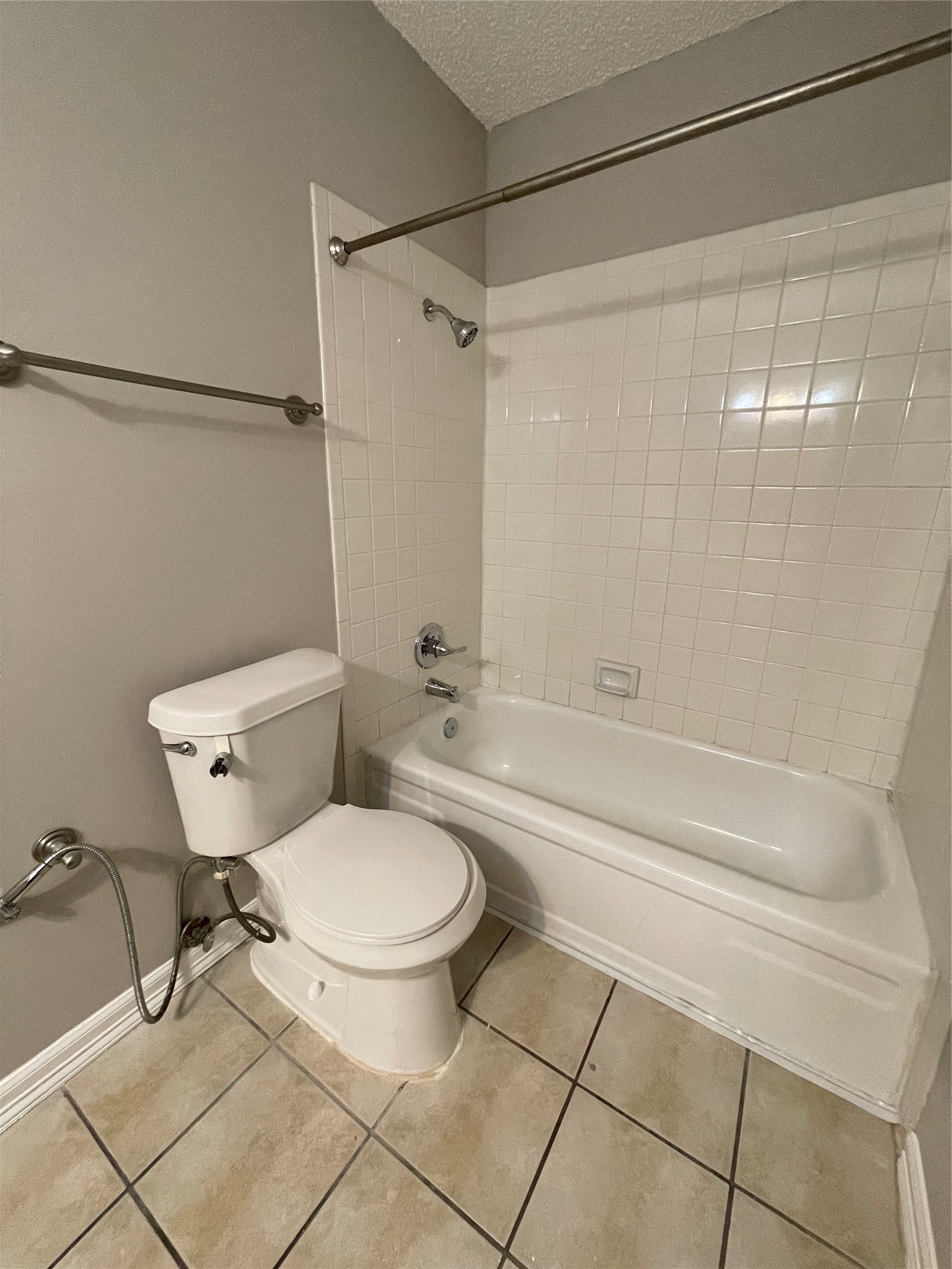 6601 Sands Point Drive, Unit 63 Houston, TX 77074 - Photo 10 of 18 a bathroom with a toilet and a shower