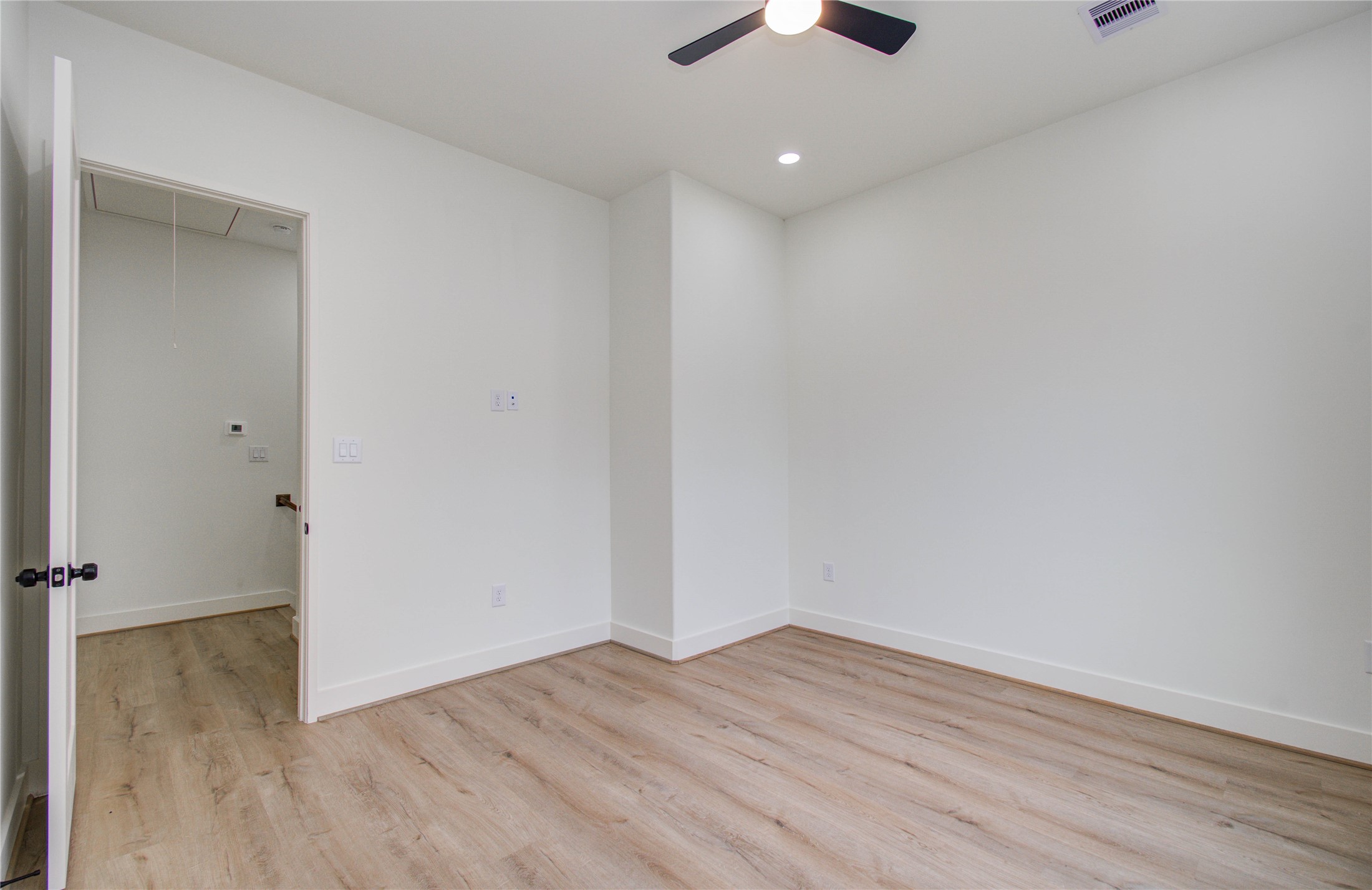 1815 McKee Street, Unit 1 Houston, TX 77009 - Photo 21 of 25 an empty room with wooden floor and ceiling fan