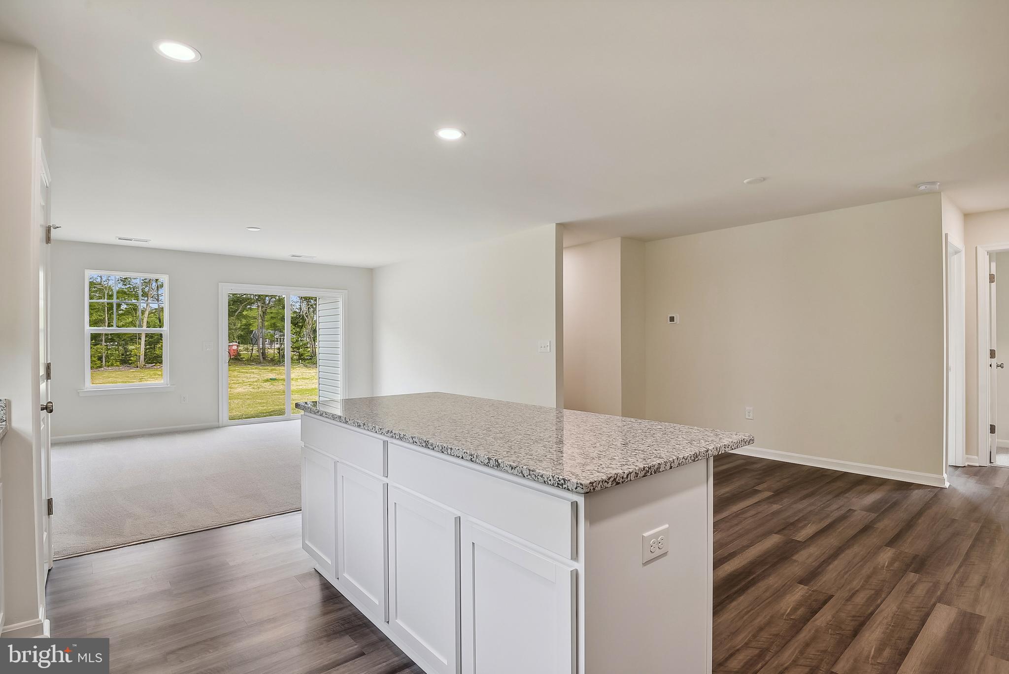 Ohio Avenue Earleville, MD 21919 - Photo 14 of 60 a hall with kitchen island granite countertop wooden floor and a large window