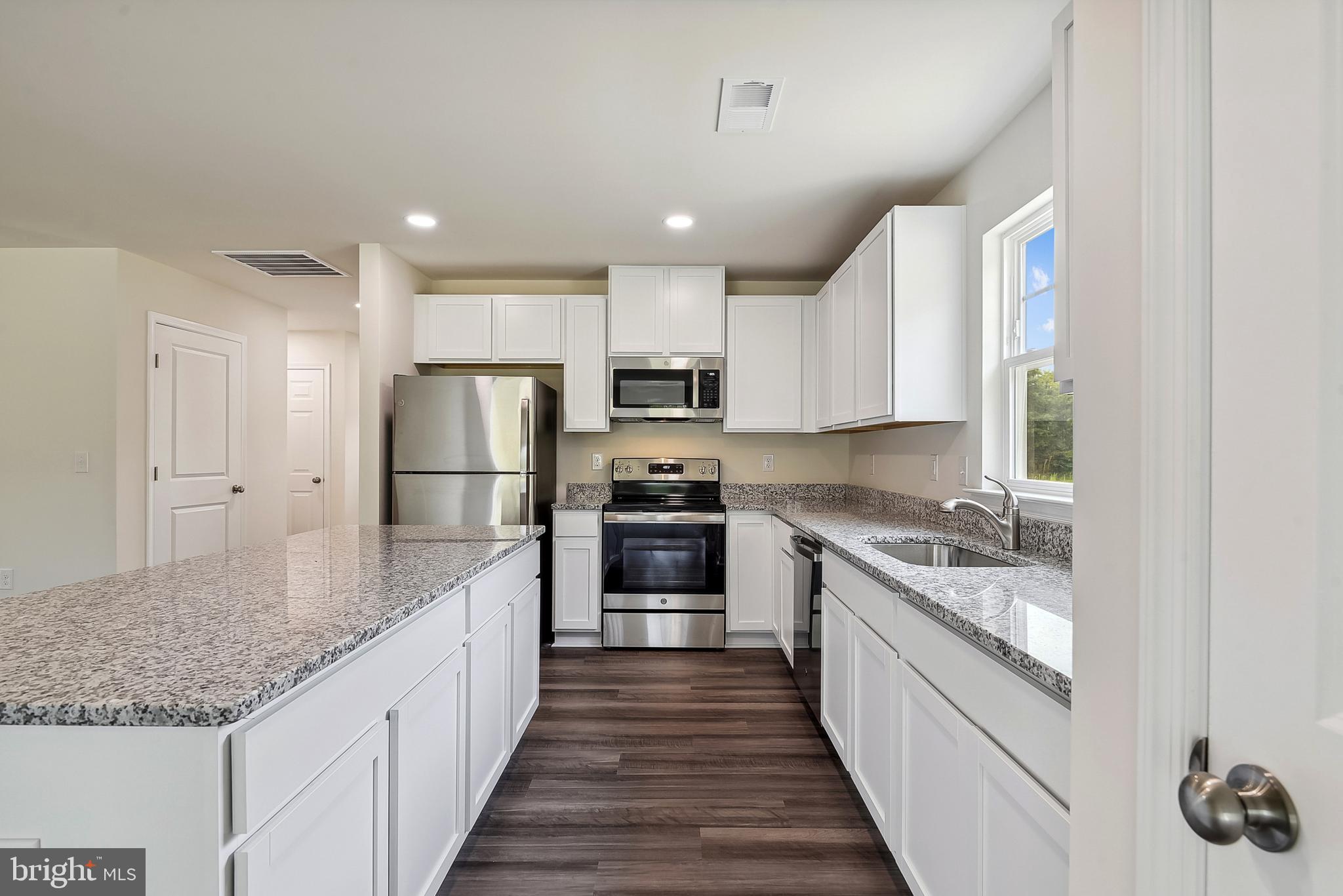 Ohio Avenue Earleville, MD 21919 - Photo 15 of 60 a large kitchen with kitchen island granite countertop a large counter top and stainless steel appliances