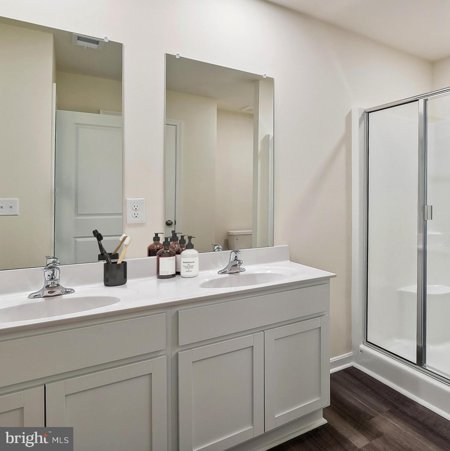 Ohio Avenue Earleville, MD 21919 - Photo 36 of 60 a bathroom with a double vanity sink and mirror