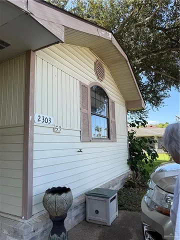 a view of a chair and table in backyard