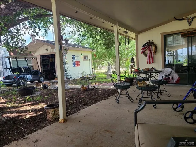 a view of swimming pool with outdoor seating