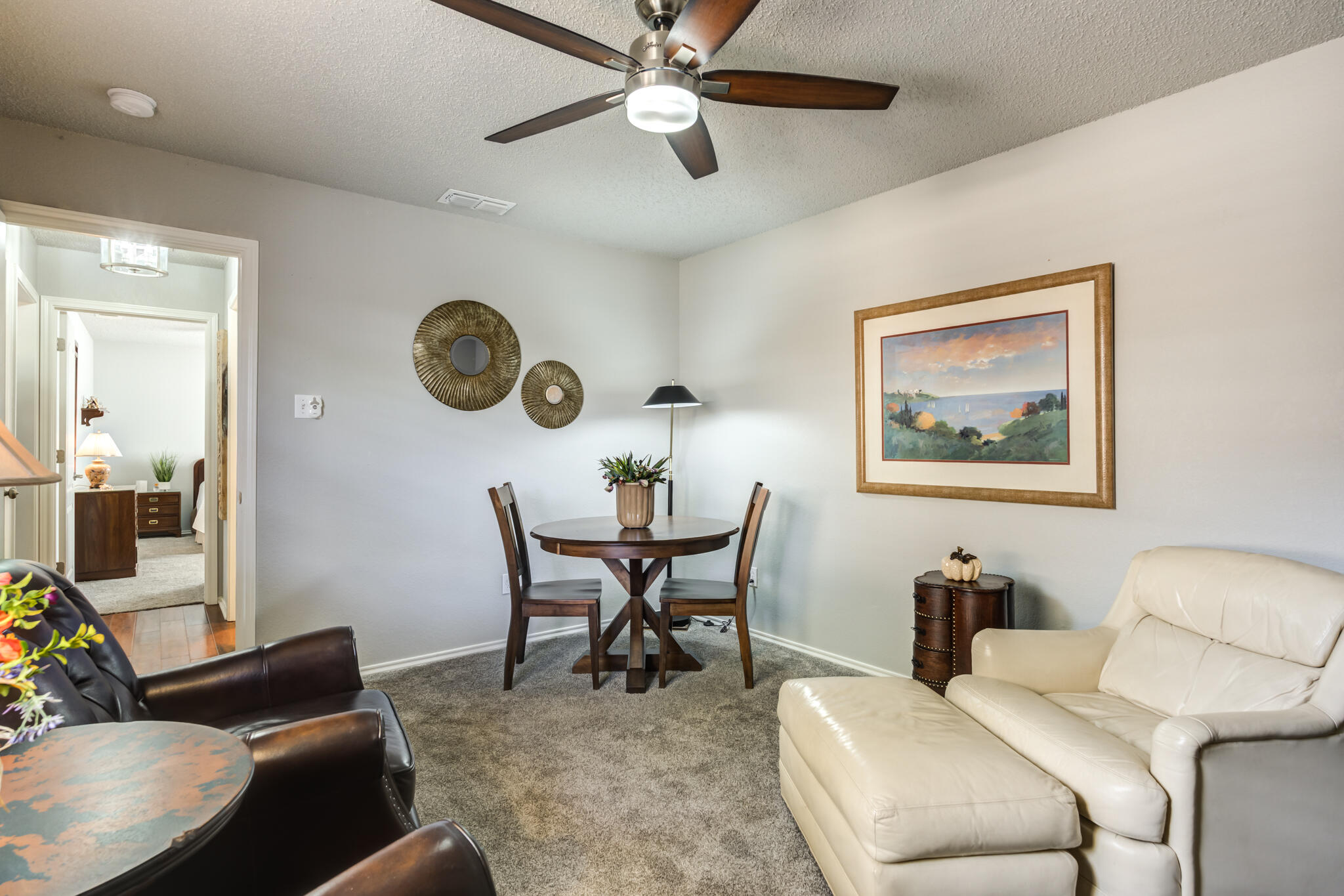 8204 Colton Avenue Lubbock, TX 79424 - Photo 11 of 19 a living room with furniture a clock on wall and a window