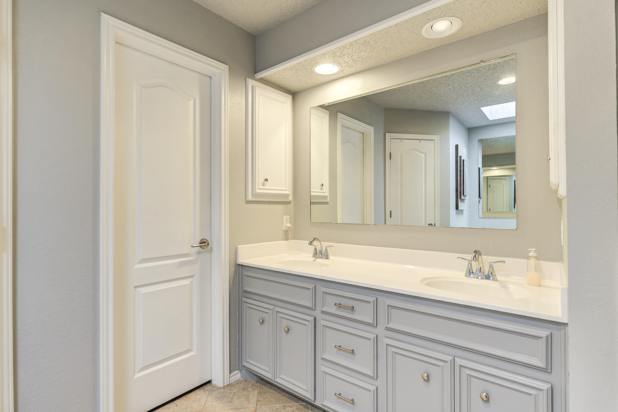 8204 Colton Avenue Lubbock, TX 79424 - Photo 16 of 19 a bathroom with a sink and a mirror