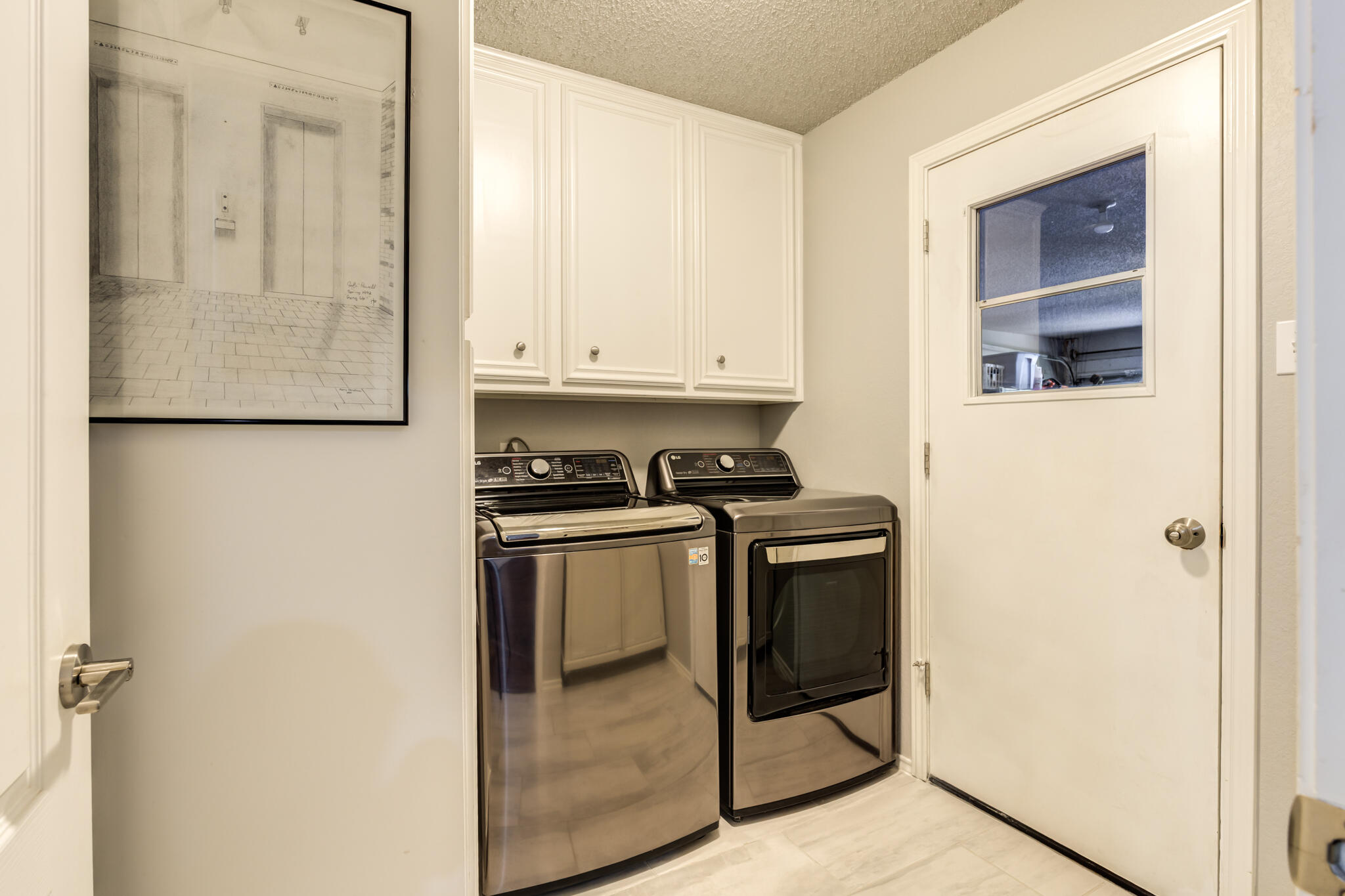 8204 Colton Avenue Lubbock, TX 79424 - Photo 18 of 19 a kitchen with stainless steel appliances granite countertop a refrigerator and a stove
