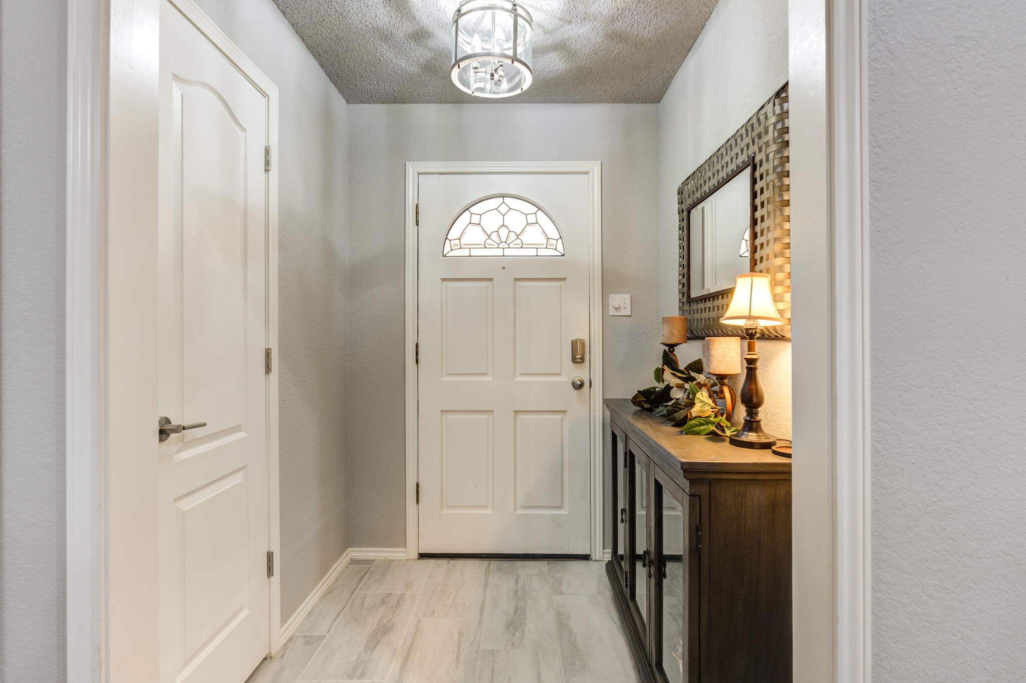 8204 Colton Avenue Lubbock, TX 79424 - Photo 7 of 19 a view of a entryway door with wooden floor