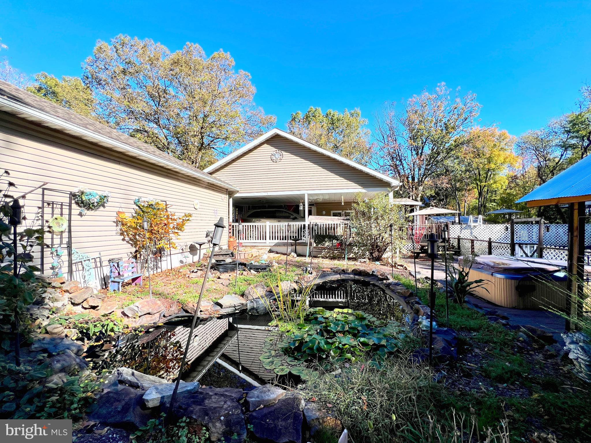 511 Pine Drive Valley View, PA 17983 - Photo 2 of 22 a view of a patio with table and chairs potted plants and large tree