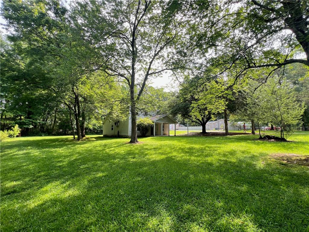 340 Womack Avenue Dallas, GA 30157 - Photo 23 of 29 a view of a trees in front of a big yard