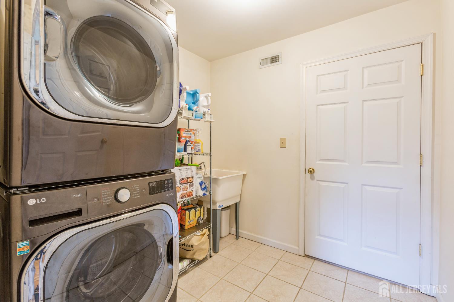 8 Longfellow Drive Colonia, NJ 07067 - Photo 11 of 24 a utility room with dryer and washer