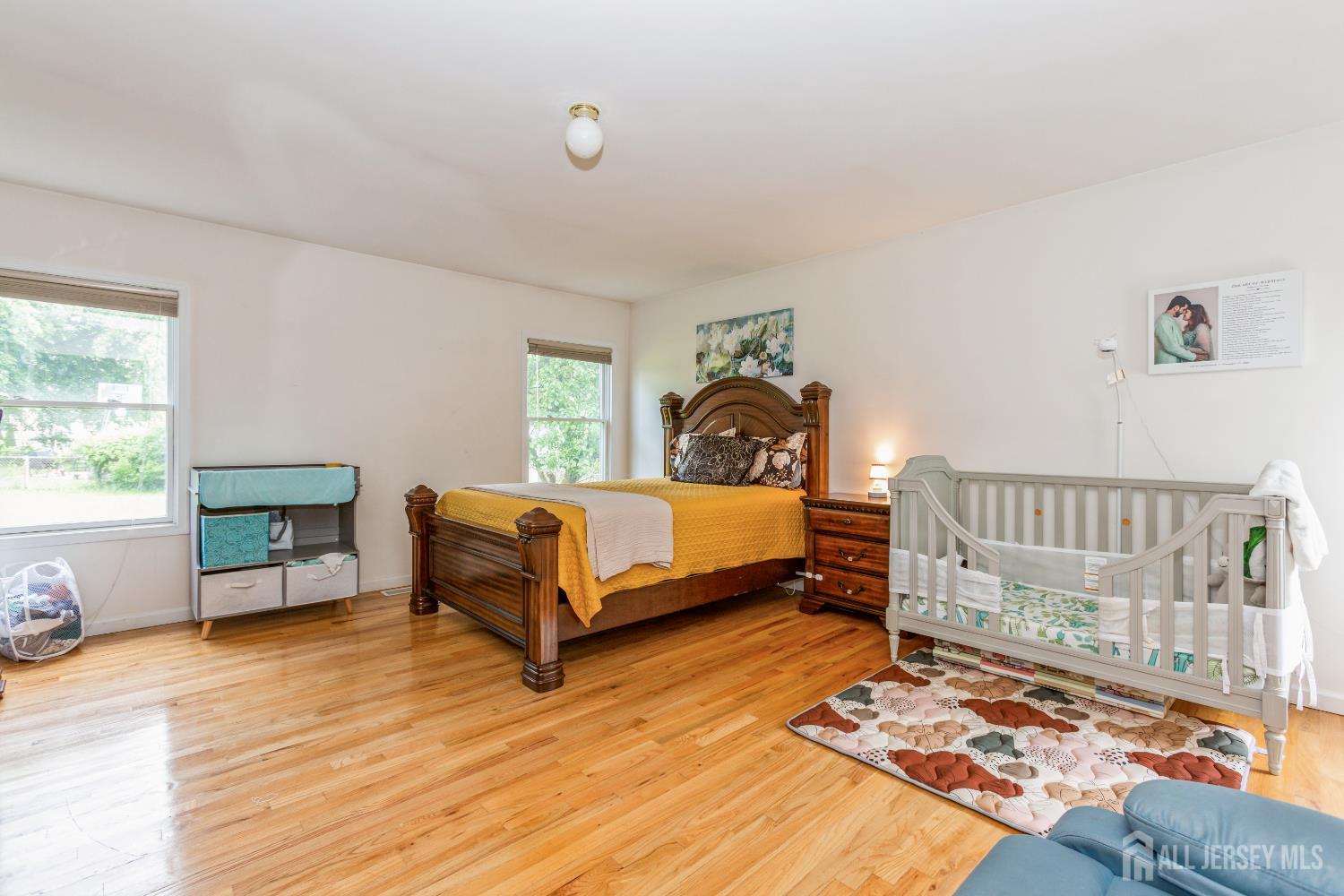 8 Longfellow Drive Colonia, NJ 07067 - Photo 12 of 24 a bedroom with a bed and a window