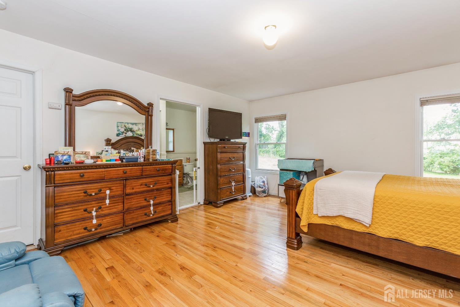 8 Longfellow Drive Colonia, NJ 07067 - Photo 13 of 24 a bedroom with a bed and a dresser