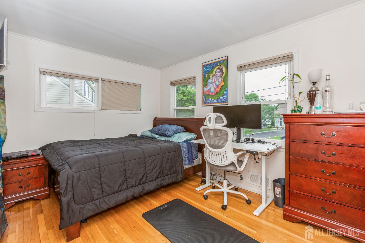 8 Longfellow Drive Colonia, NJ 07067 - Photo 15 of 24 a bedroom with a bed and a table