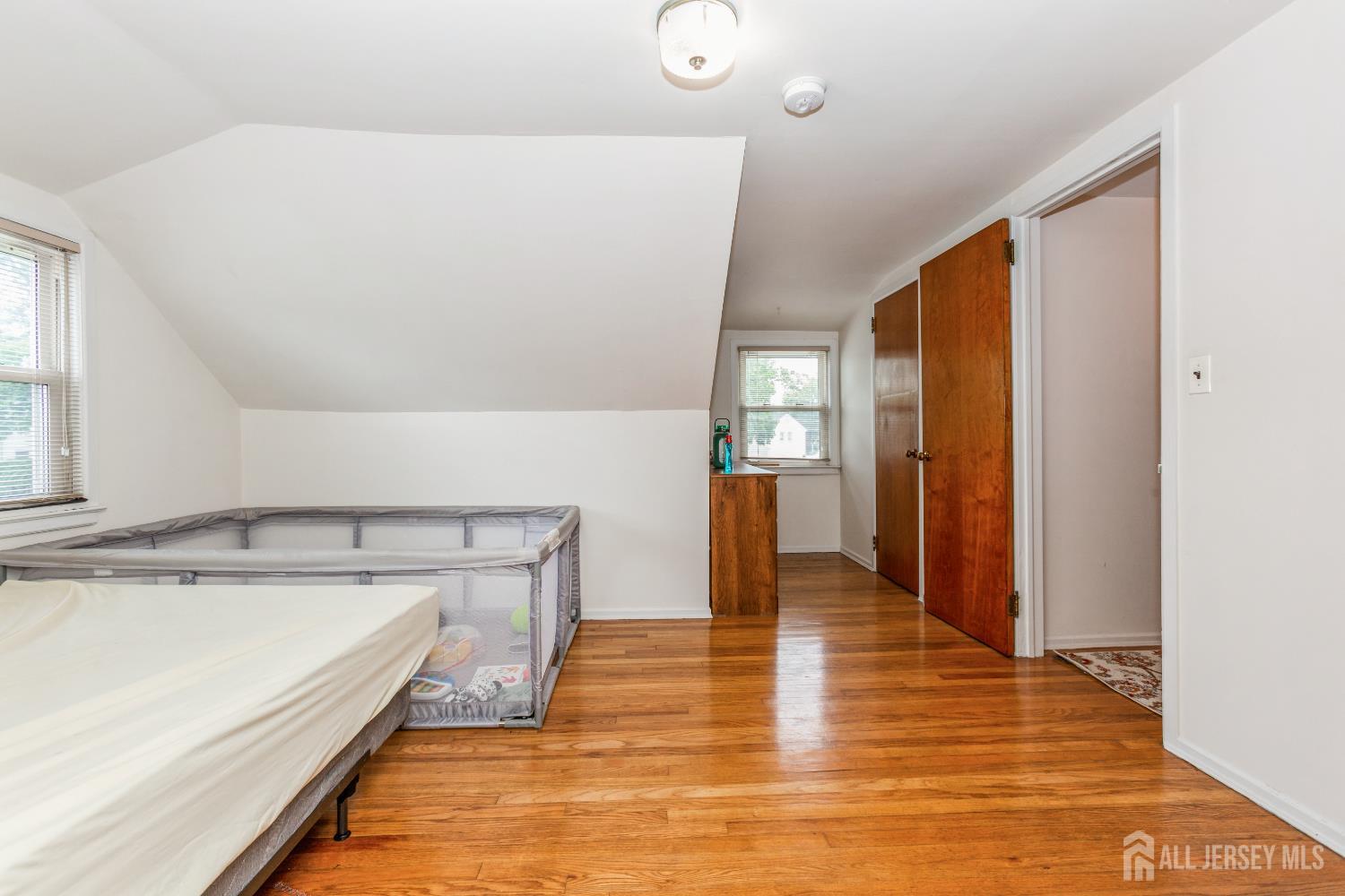 8 Longfellow Drive Colonia, NJ 07067 - Photo 18 of 24 a view of a kitchen with wooden floor and a sink