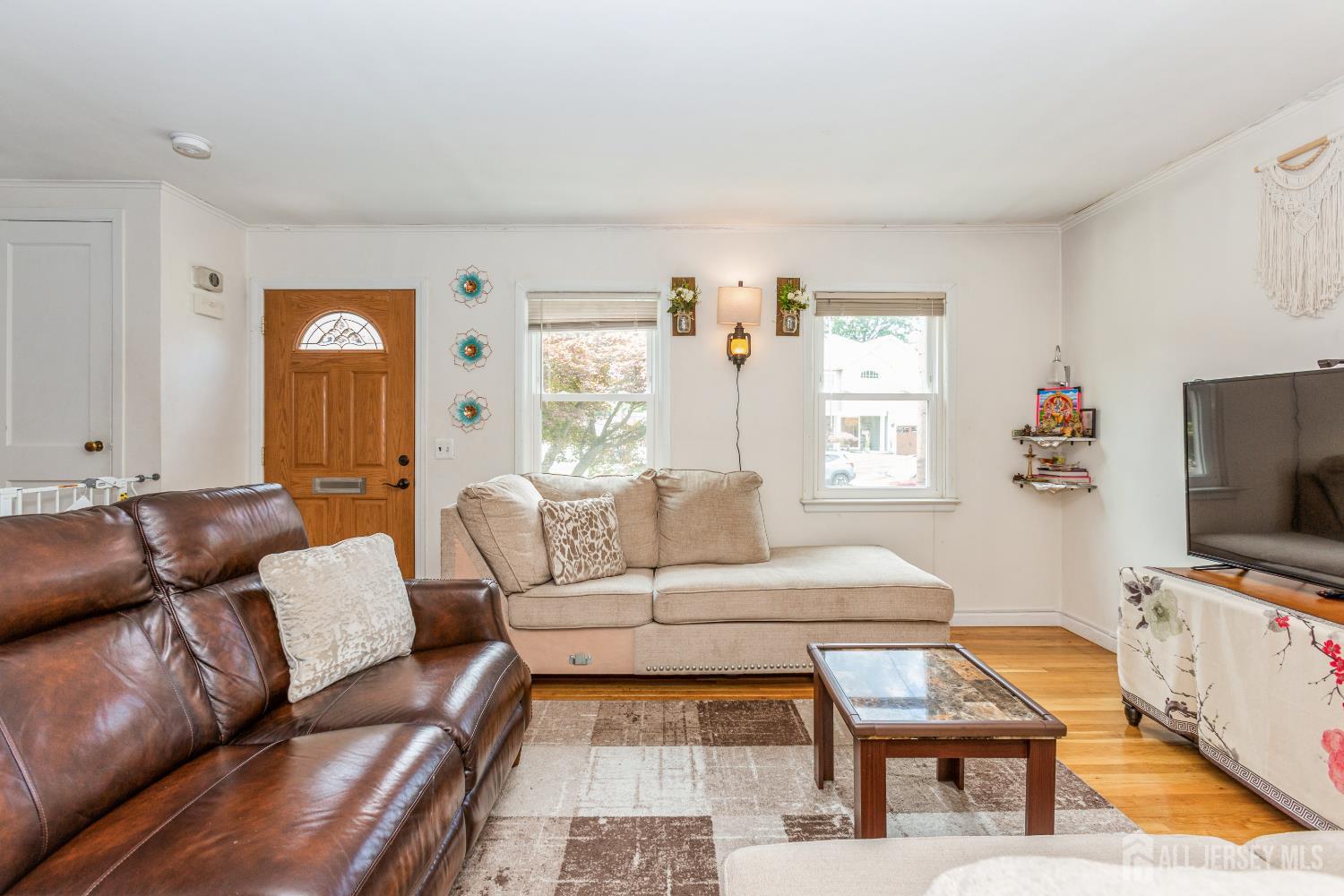 8 Longfellow Drive Colonia, NJ 07067 - Photo 4 of 24 a living room with furniture and a flat screen tv