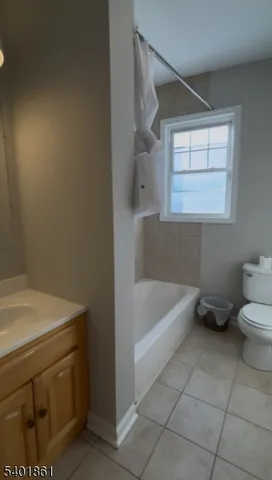 a bathroom with a sink a toilet and bathtub