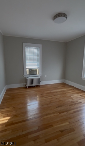 665 Ridgewood Road, Unit 8 Millburn, NJ 07041 - Photo 5 of 10 a view of an empty room with wooden floor and a window