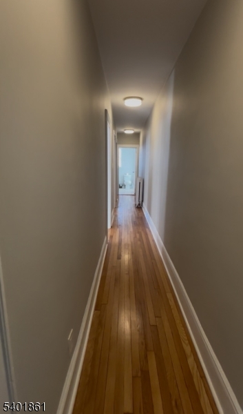 665 Ridgewood Road, Unit 8 Millburn, NJ 07041 - Photo 7 of 10 a view of a hallway with wooden floor