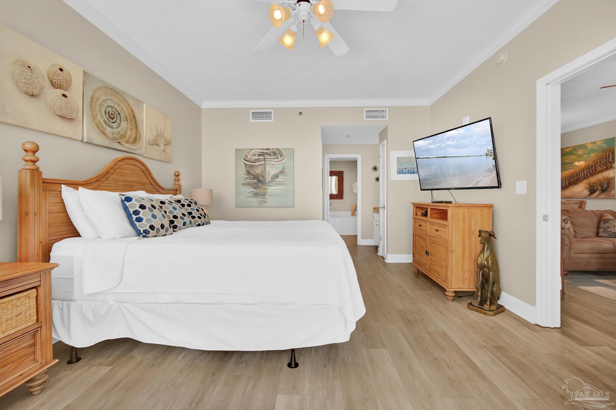 13661 Perdido Key Drive, Unit 1603 Perdido Key, FL 32507 - Photo 25 of 50 a bedroom with a bed and wooden floor