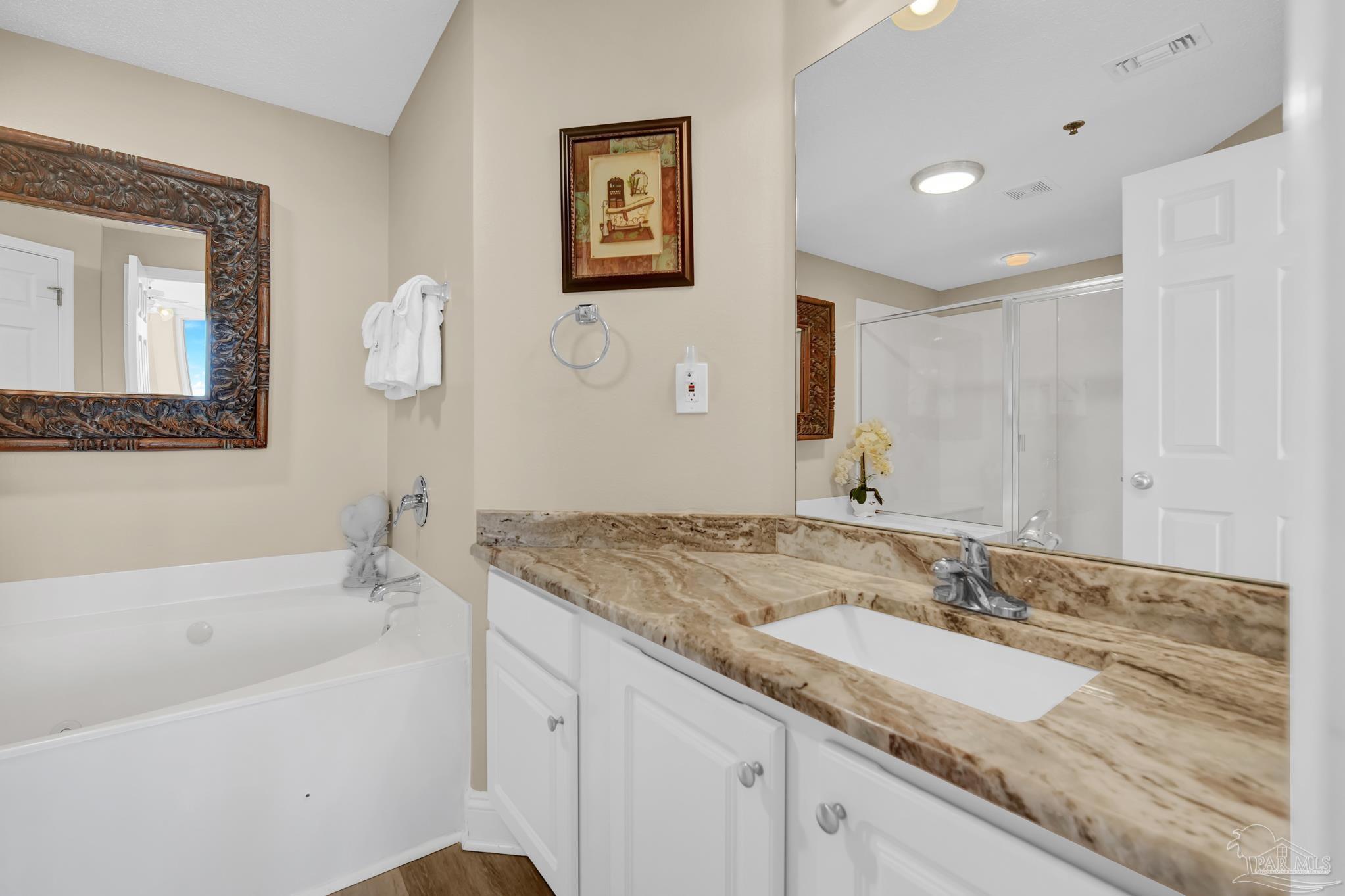 13661 Perdido Key Drive, Unit 1603 Perdido Key, FL 32507 - Photo 28 of 50 a bathroom with a granite countertop sink mirror and bathtub
