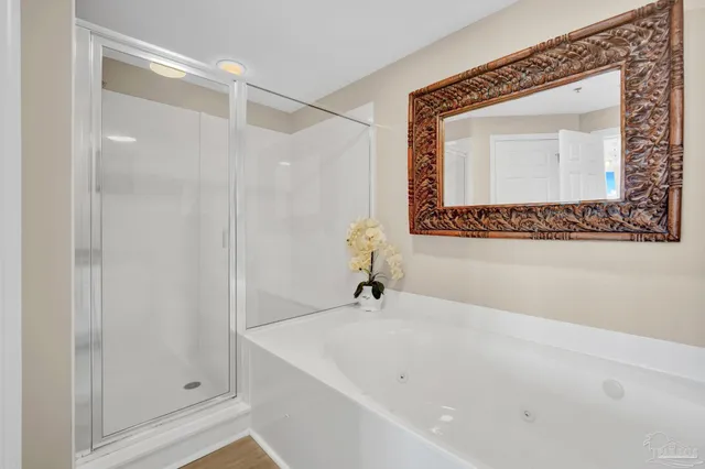 a bathroom with a bathtub and a shower