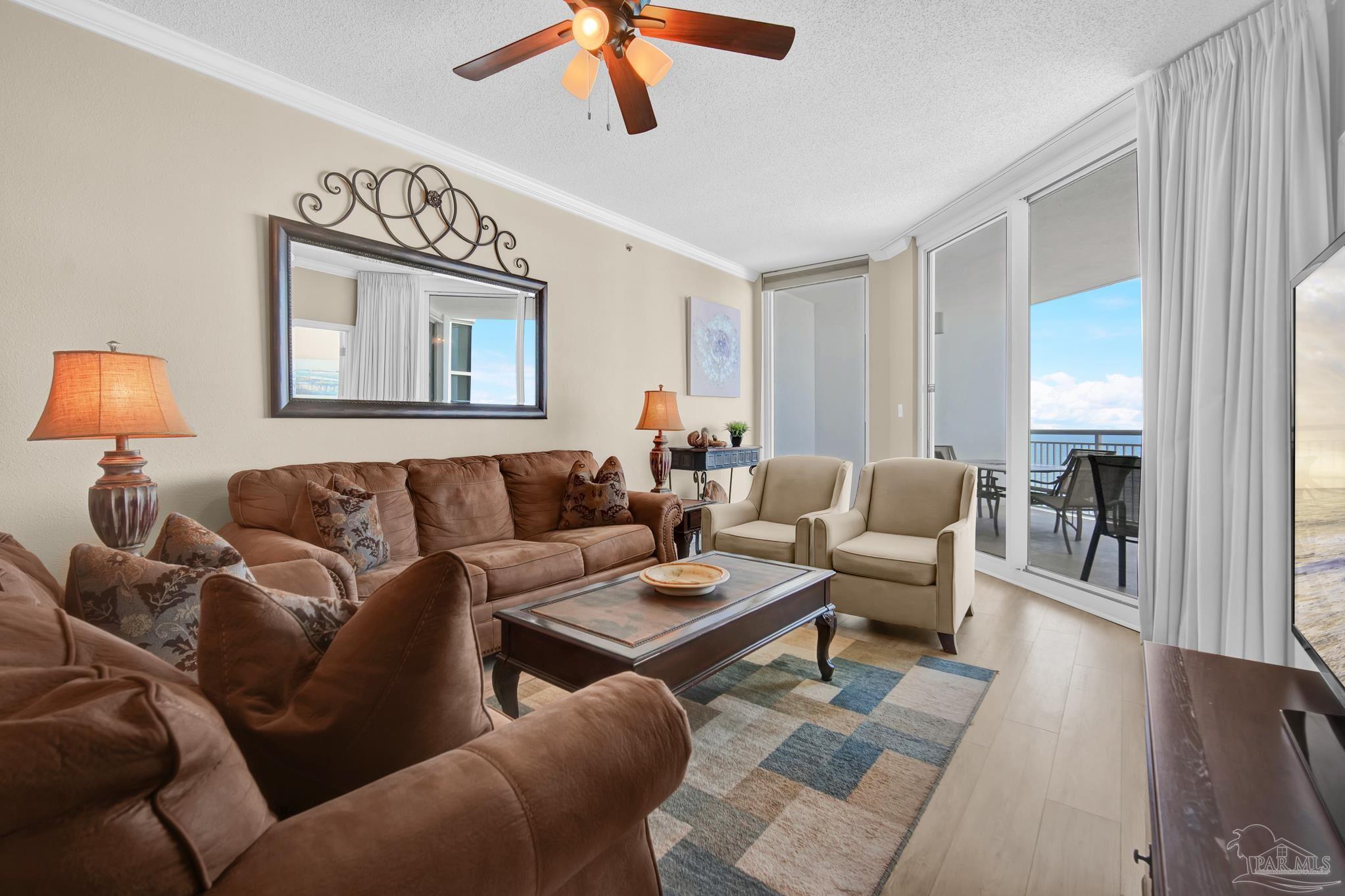 13661 Perdido Key Drive, Unit 1603 Perdido Key, FL 32507 - Photo 3 of 50 a living room with furniture and a wooden floor