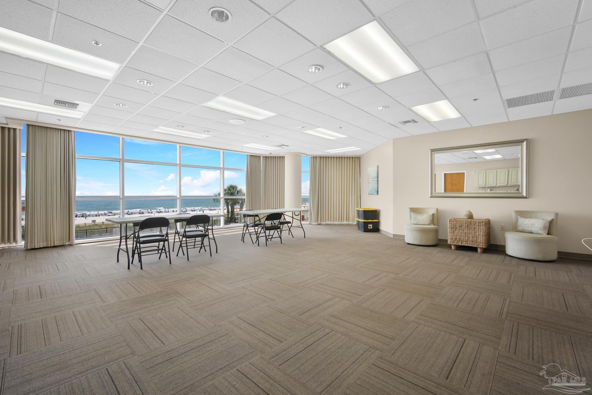 13661 Perdido Key Drive, Unit 1603 Perdido Key, FL 32507 - Photo 37 of 50 a living room with furniture and a table
