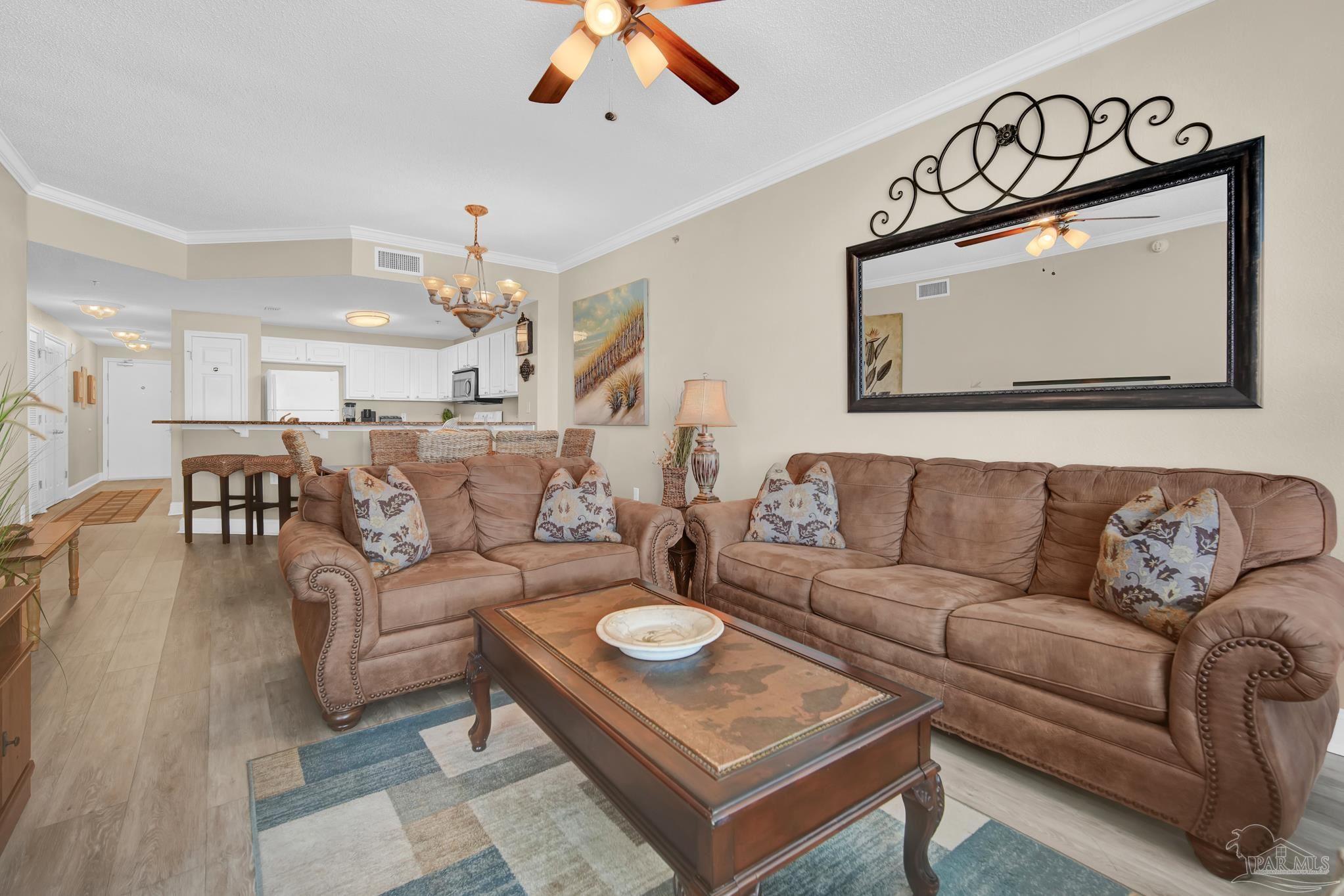 13661 Perdido Key Drive, Unit 1603 Perdido Key, FL 32507 - Photo 4 of 50 a living room with furniture a rug and a chandelier