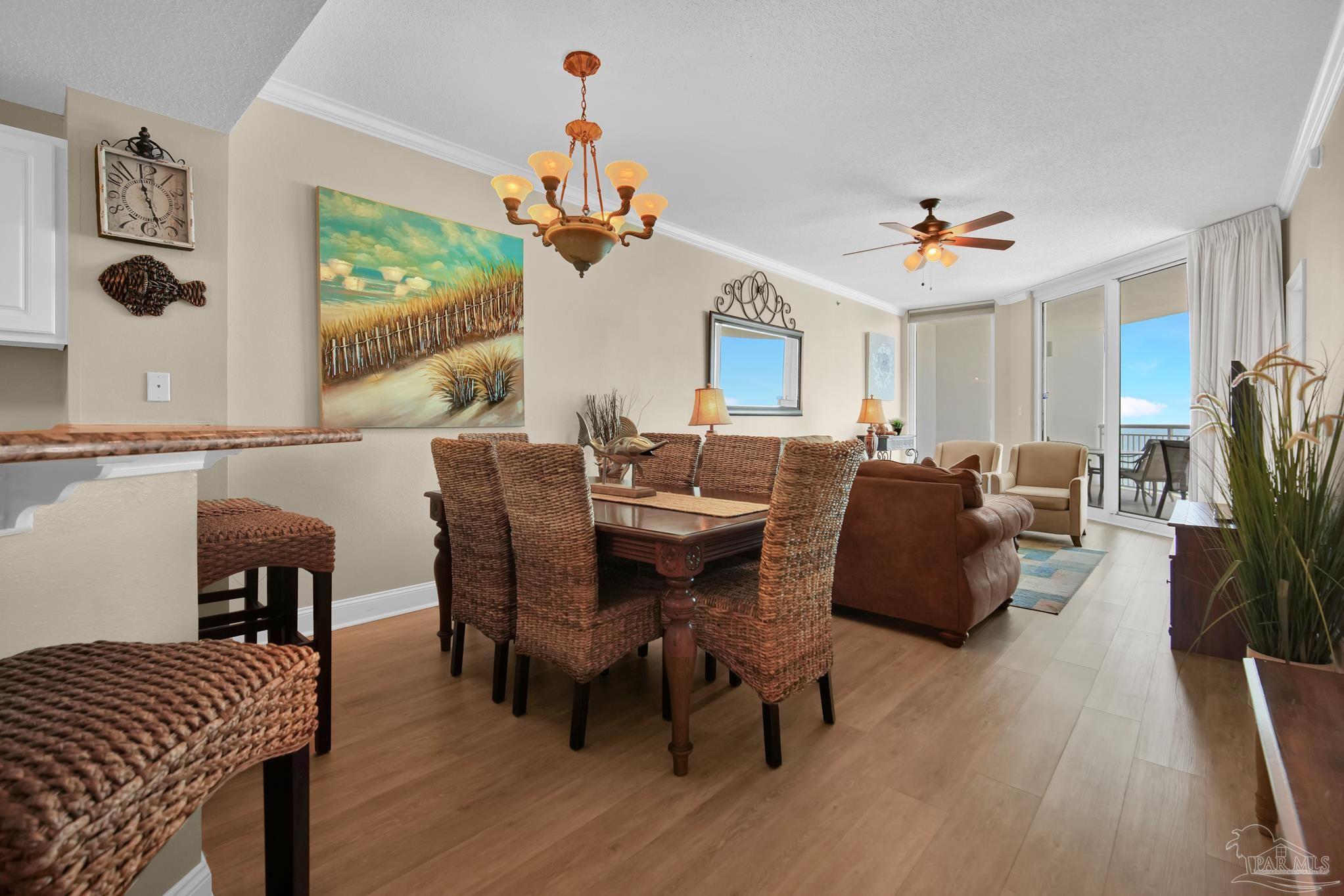 13661 Perdido Key Drive, Unit 1603 Perdido Key, FL 32507 - Photo 8 of 50 a living room with furniture a fireplace and a flat screen tv