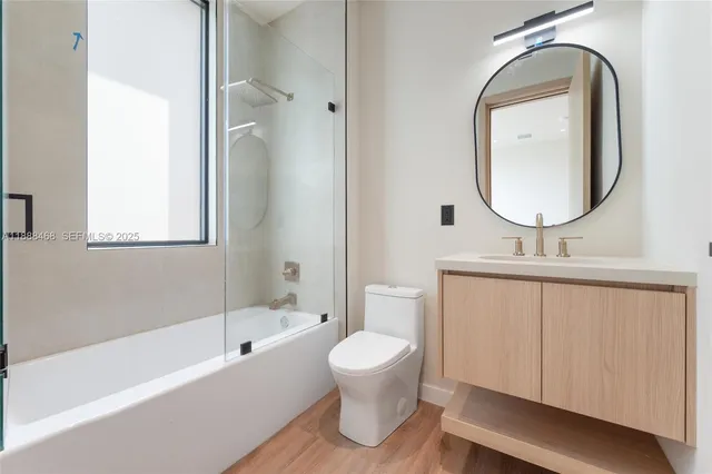 a bathroom with a toilet a sink and a bathtub