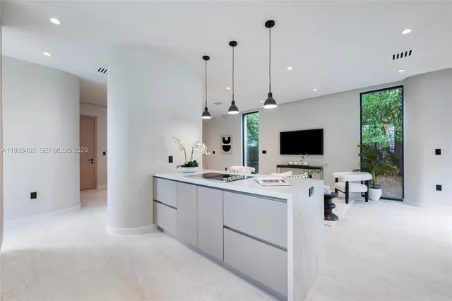 a view of living room with furniture and flat screen tv