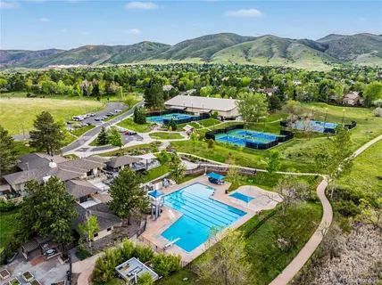an aerial view of a pool patio swimming pool and mountain view