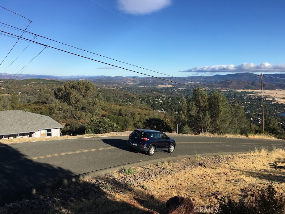 15927 Eagle Rock Road Hidden Valley Lake, CA 95467 - Photo 18 of 65 a view of a street with an ocean view