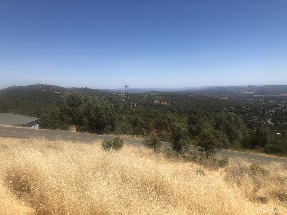 15927 Eagle Rock Road Hidden Valley Lake, CA 95467 - Photo 26 of 65 a view of a lake with a mountain